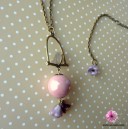 Collier long fantaisie bronze avec oiseau sur son perchoir
